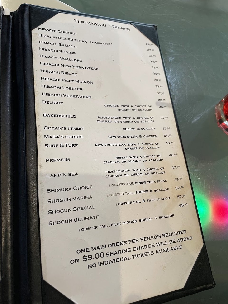 Printed menu for hibachi and sushi selections.